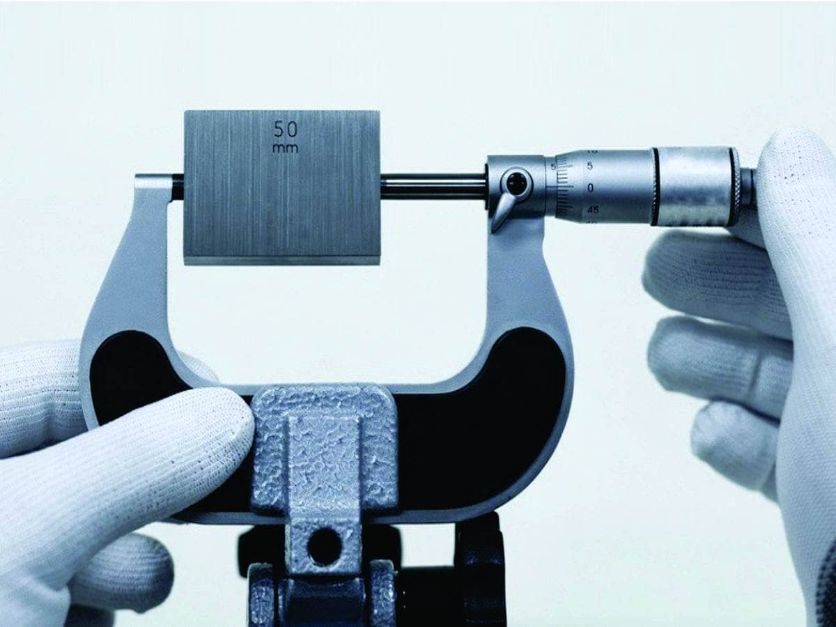 micrometer being calibrated