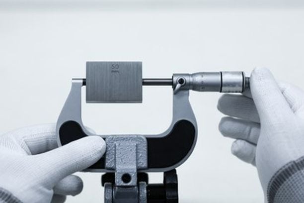 micrometer being calibrated